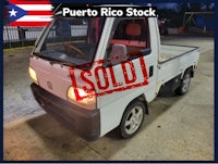 puerto rico stock sells a white truck in a parking lot